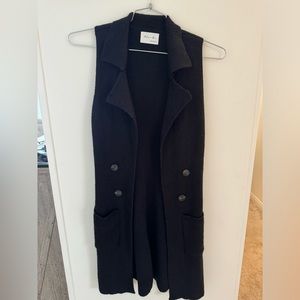Size small black long sweater vest, small hole on back